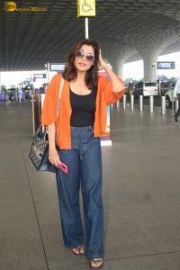 bollywood actress Chitrangada Singh stylish in a black top and orange shirt