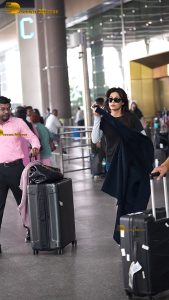 actress Chitrangada Singh pretty in t-shirt and sunglasses at airport