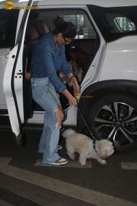 Indian model and actress Daisy Shah in a blue shirt and jeans at mumbai airport