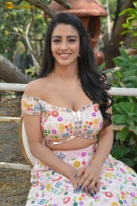 actress daksha nagarkar in a low neck shoulderless dress