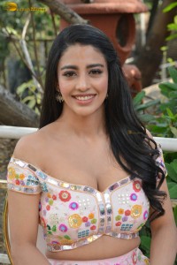 actress daksha nagarkar in a low neck shoulderless dress