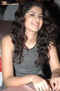 Actress Deeksha Seth dressed in black and white attending a cinema event