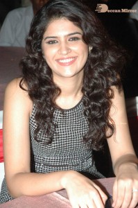 Actress Deeksha Seth dressed in black and white attending a cinema event