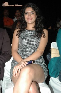 Actress Deeksha Seth dressed in black and white attending a cinema event