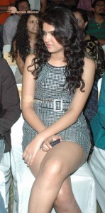 Actress Deeksha Seth dressed in black and white attending a cinema event