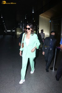 actress deepika padukone seen at mumbai airport in a green pant suit