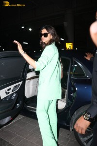 actress deepika padukone seen at mumbai airport in a green pant suit