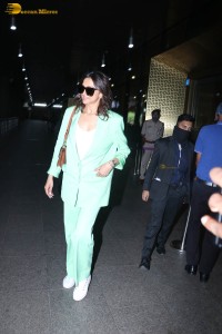 actress deepika padukone seen at mumbai airport in a green pant suit