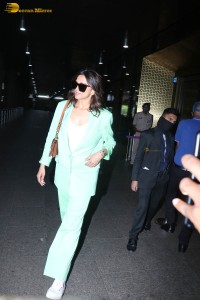 actress deepika padukone seen at mumbai airport in a green pant suit