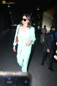actress deepika padukone seen at mumbai airport in a green pant suit