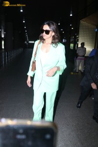 actress deepika padukone seen at mumbai airport in a green pant suit