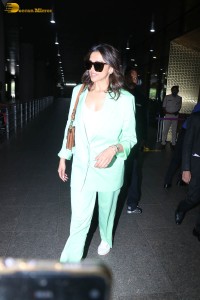 actress deepika padukone seen at mumbai airport in a green pant suit