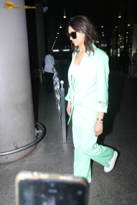 actress deepika padukone seen at mumbai airport in a green pant suit