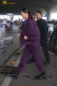 actress deepika padukone dressed in blue velvet at airport