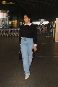 actress deepika singh in a blue sweater and denim jeans at airport