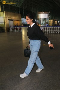 actress deepika singh in a blue sweater and denim jeans at airport