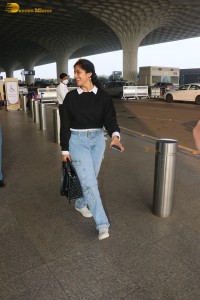 actress deepika singh in a blue sweater and denim jeans at airport