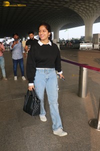 actress deepika singh in a blue sweater and denim jeans at airport