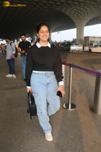 actress deepika singh in a blue sweater and denim jeans at airport