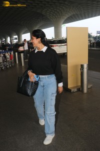 actress deepika singh in a blue sweater and denim jeans at airport