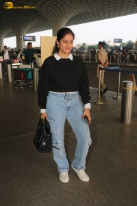 actress deepika singh in a blue sweater and denim jeans at airport