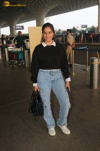 actress deepika singh in a blue sweater and denim jeans at airport