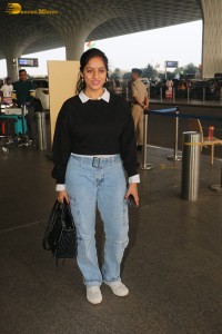 actress deepika singh in a blue sweater and denim jeans at airport