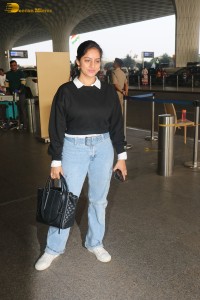 actress deepika singh in a blue sweater and denim jeans at airport