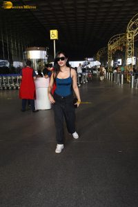 actress Dhanashree Verma pretty in a blue top at airport