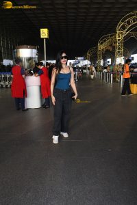 actress Dhanashree Verma pretty in a blue top at airport