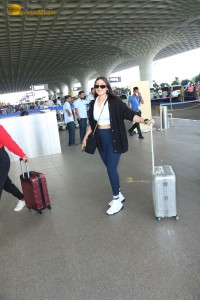 Bollywood Singer Dhvani Bhanushali in white t-shirt seen traveling from Mumbai Airport