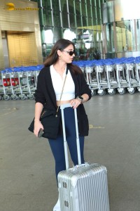 Bollywood Singer Dhvani Bhanushali in white t-shirt seen traveling from Mumbai Airport
