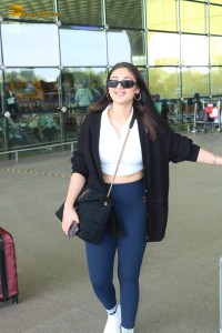 Bollywood Singer Dhvani Bhanushali in white t-shirt seen traveling from Mumbai Airport