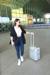 Bollywood Singer Dhvani Bhanushali in white t-shirt seen traveling from Mumbai Airport