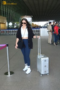 Bollywood Singer Dhvani Bhanushali in white t-shirt seen traveling from Mumbai Airport
