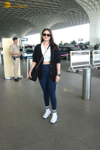 Bollywood Singer Dhvani Bhanushali in white t-shirt seen traveling from Mumbai Airport