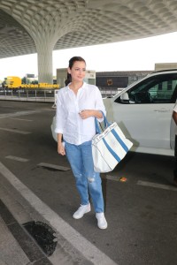 Dia Mirza in a white shirt and blue jeans at Mumbai Airport