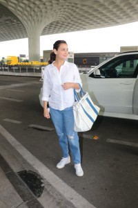 Dia Mirza in a white shirt and blue jeans at Mumbai Airport