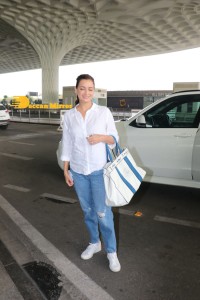 Dia Mirza in a white shirt and blue jeans at Mumbai Airport