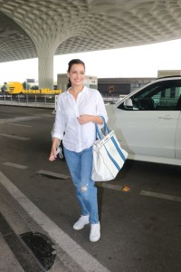 Dia Mirza in a white shirt and blue jeans at Mumbai Airport