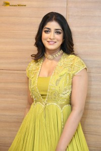 actress dimple hayathi in a yellow dress at a movie function
