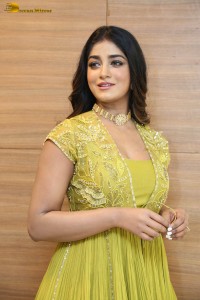 actress dimple hayathi in a yellow dress at a movie function