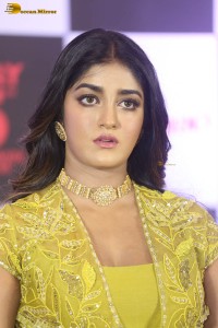 actress dimple hayathi in a yellow dress at a movie function