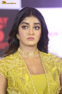 actress dimple hayathi in a yellow dress at a movie function