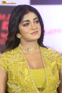 actress dimple hayathi in a yellow dress at a movie function