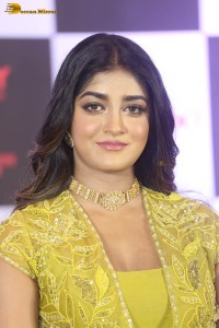 actress dimple hayathi in a yellow dress at a movie function