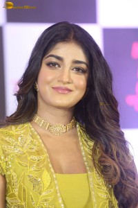 actress dimple hayathi in a yellow dress at a movie function