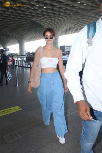 bollywood actress Disha Patani scorching hot looks in a white top at mumbai airport