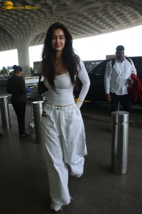 bollywood actress Disha Patani sizzling in white dress at mumbai airport
