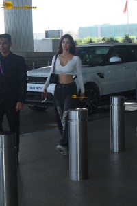 bollywood actress disha patani in a white top at mumbai airport